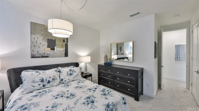 a view of porch with a table and chairs