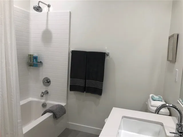 a view of a livingroom with furniture and a window