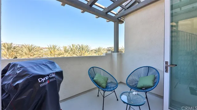 a view of a chairs and table in the patio