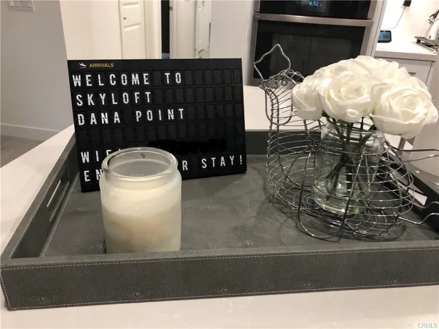 an outdoor space with lots of white furniture