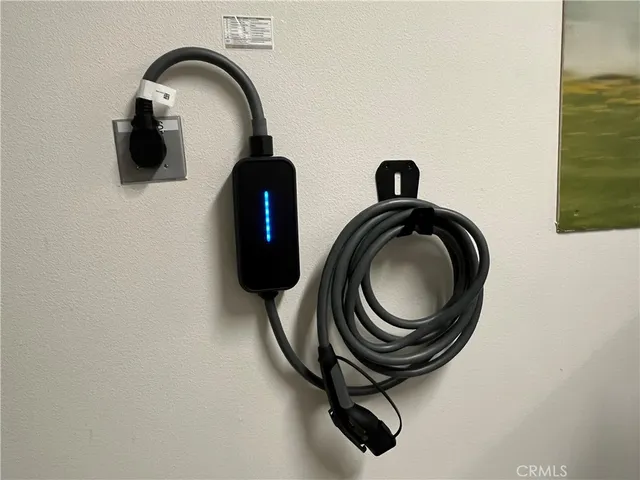 a view of a patio with table and chairs potted plants