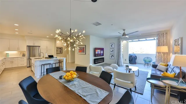 a living room with furniture and a lamp