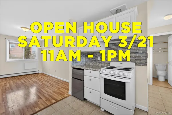 a kitchen with granite countertop white cabinets white appliances with a sink and dishwasher