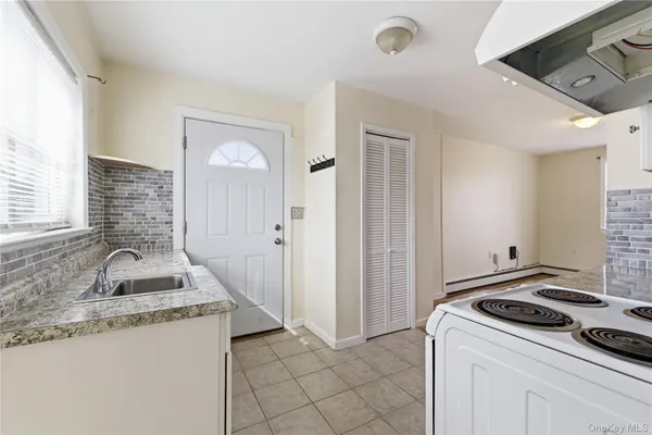 a bathroom with a toilet a sink and shower