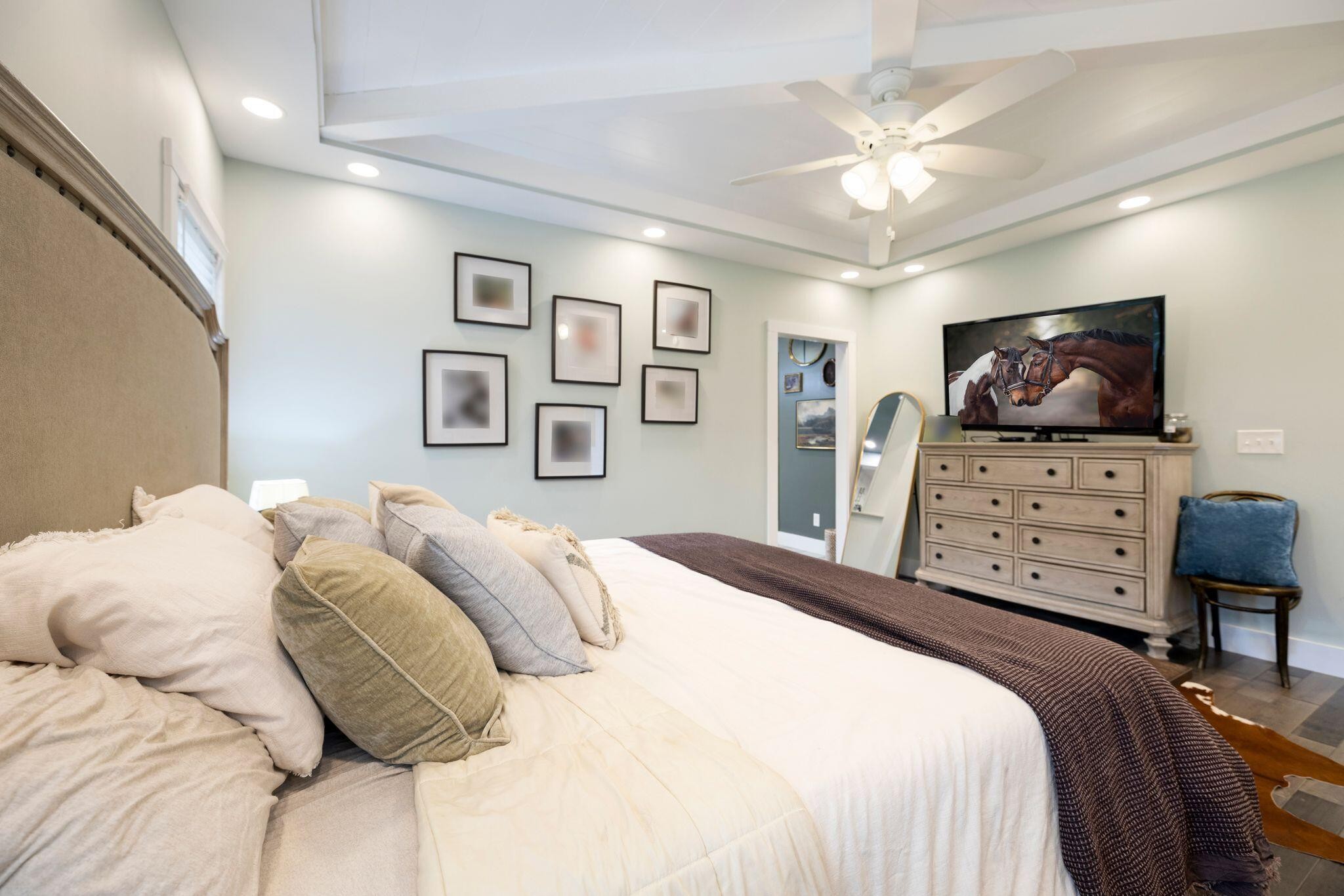 6866 Daus Mountain Road Whitwell, TN 37397 - Photo 16 of 49 a bedroom with a bed and dresser with the projector