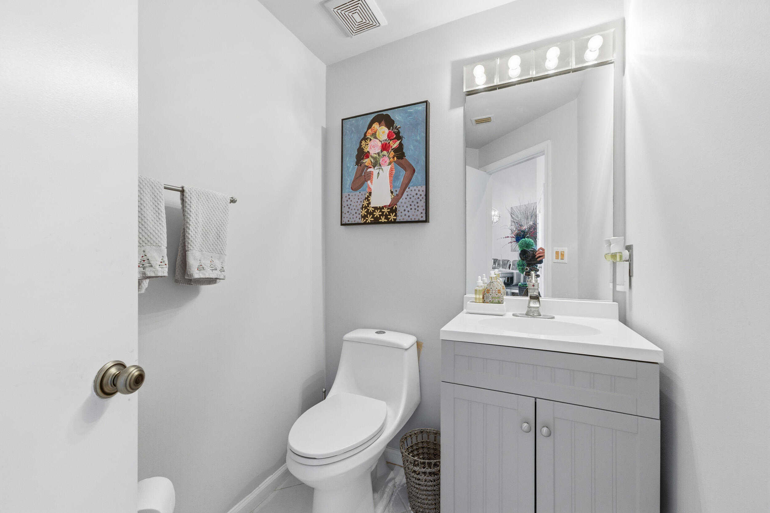2495 Northwest 66th Drive Boca Raton, FL 33496 - Photo 18 of 74 a bathroom with a toilet a sink and mirror