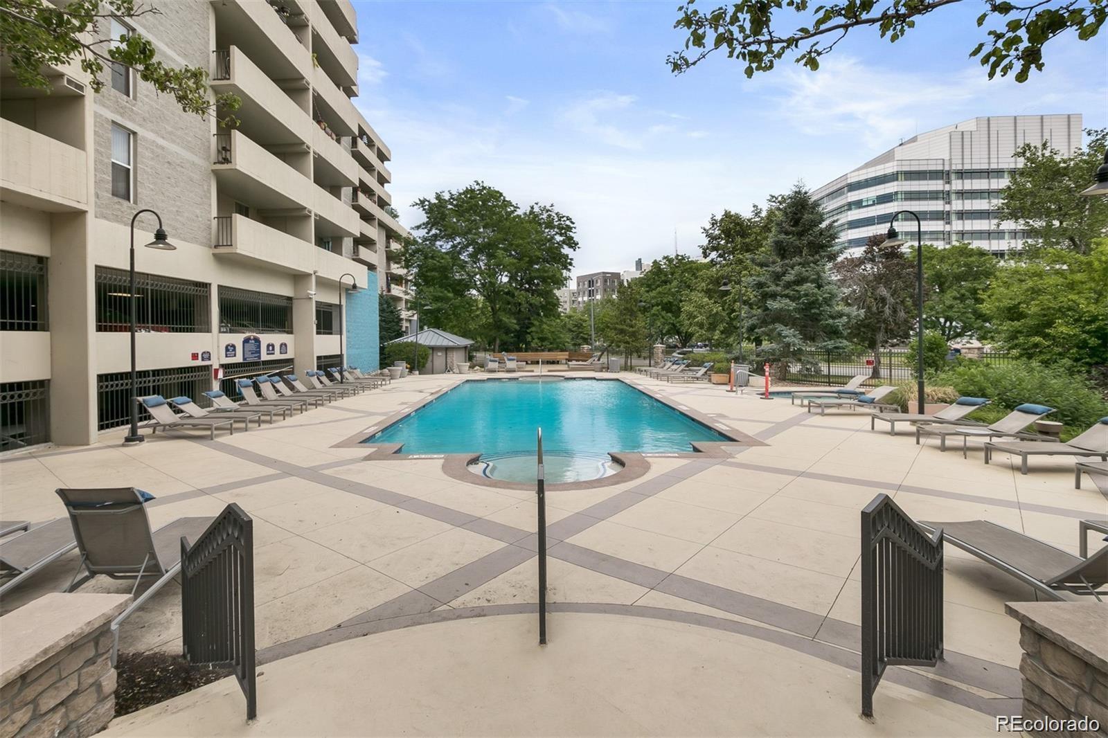 1150 Inca Street, Unit 46 Denver, CO 80204 - Photo 32 of 45 a swimming pool with outdoor seating and yard