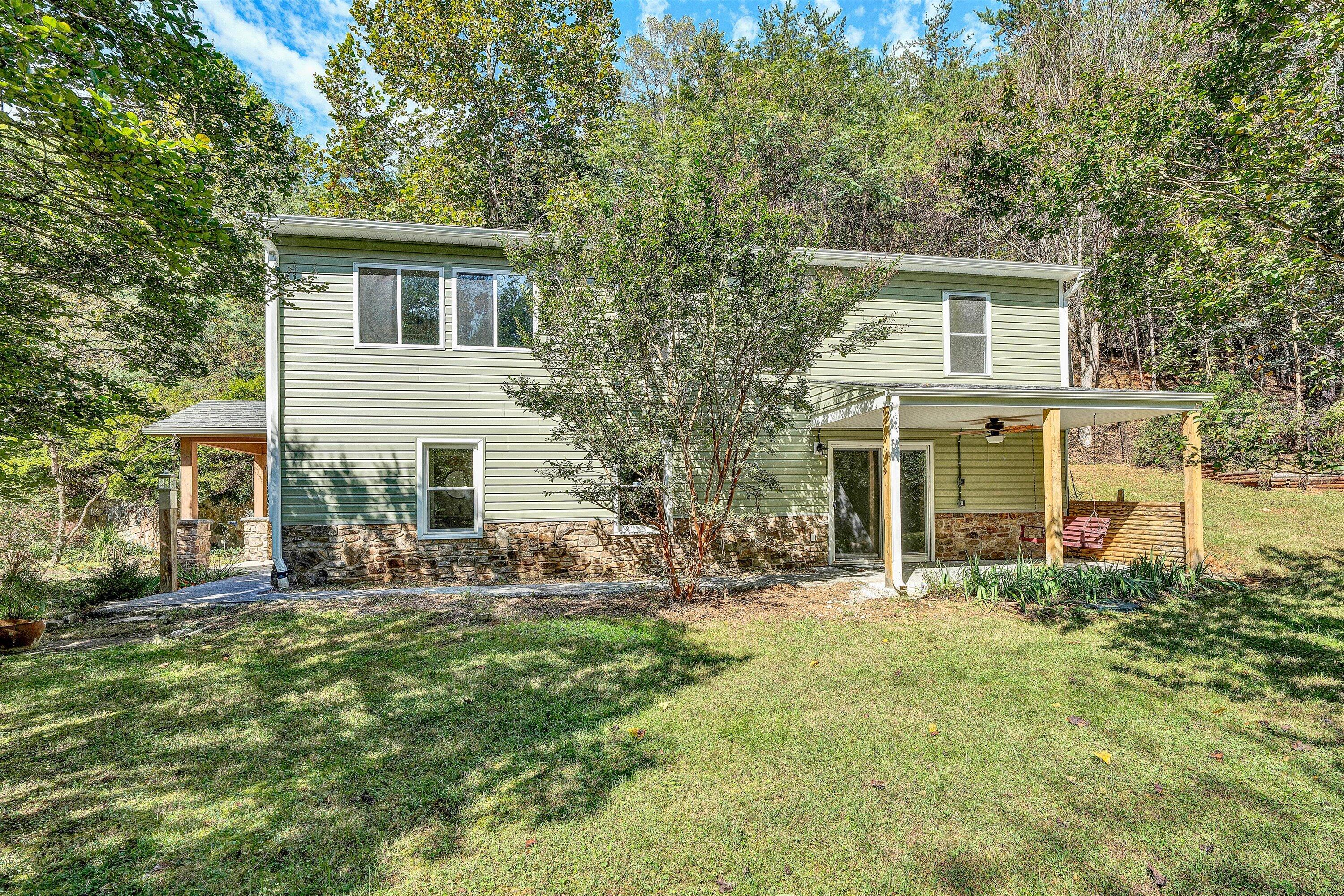 3561 Rutrough Road Southeast Roanoke, VA 24014 - Photo 1 of 63 a front view of house with outdoor seating and yard