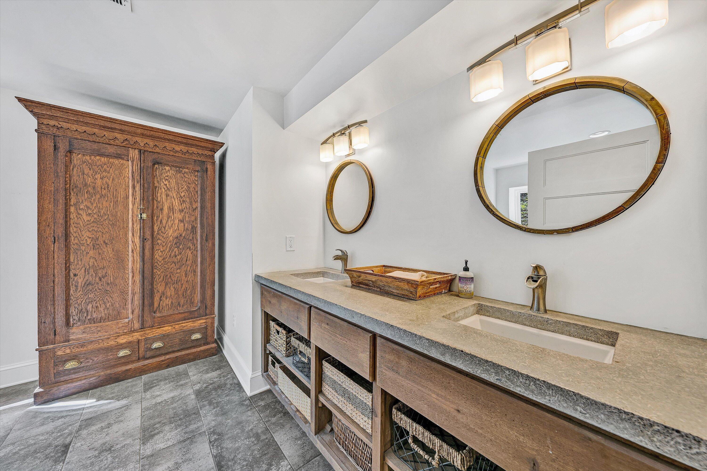3561 Rutrough Road Southeast Roanoke, VA 24014 - Photo 21 of 63 a bathroom with a granite countertop double vanity sink and a mirror