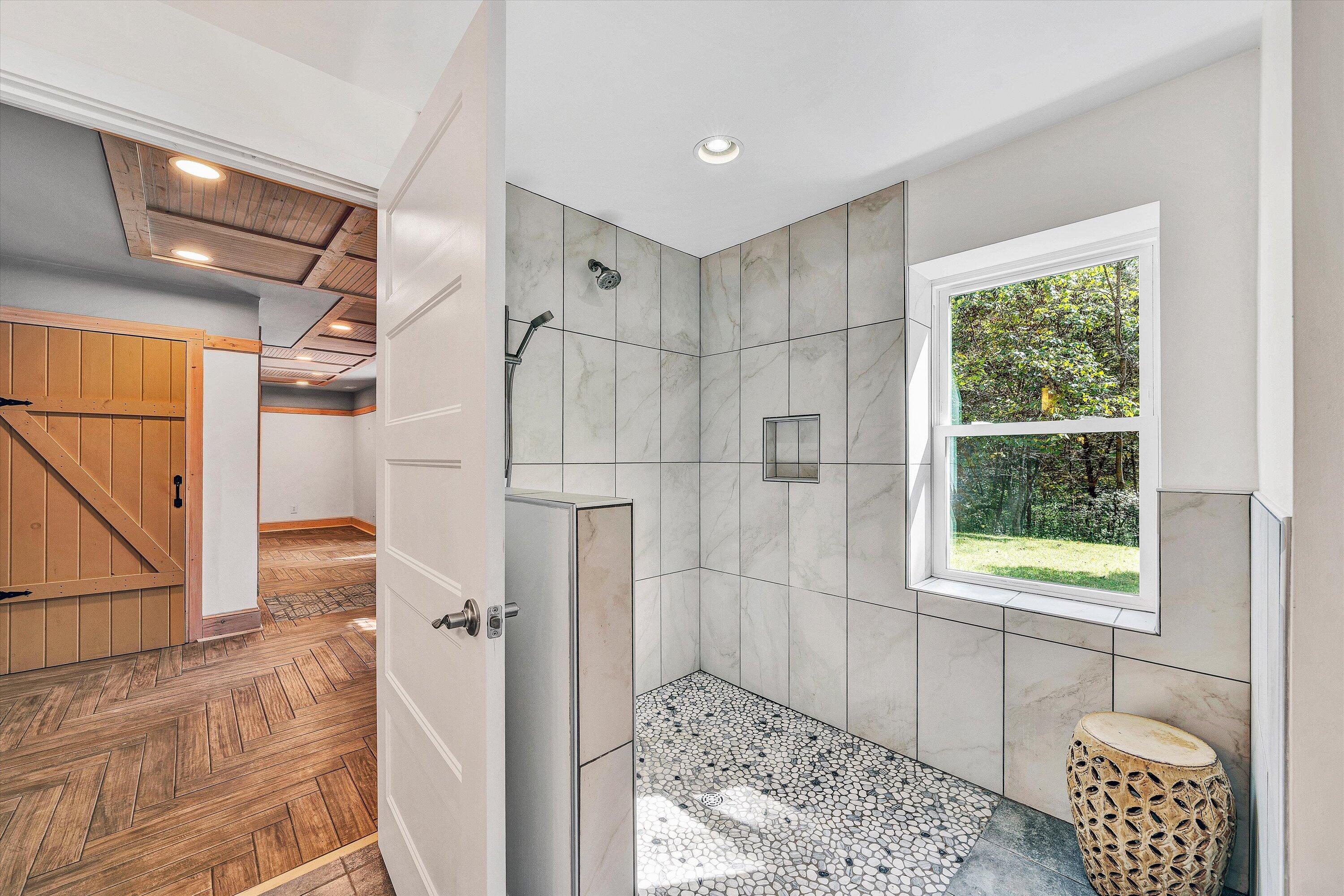 3561 Rutrough Road Southeast Roanoke, VA 24014 - Photo 22 of 63 a bathroom with a bathtub and a shower