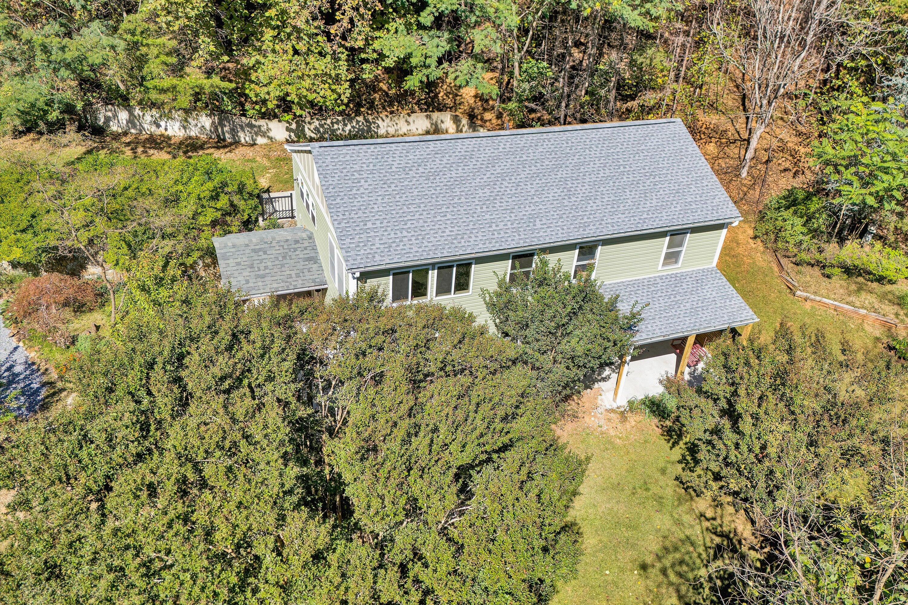 3561 Rutrough Road Southeast Roanoke, VA 24014 - Photo 3 of 63 a aerial view of a house with garden space and sitting area