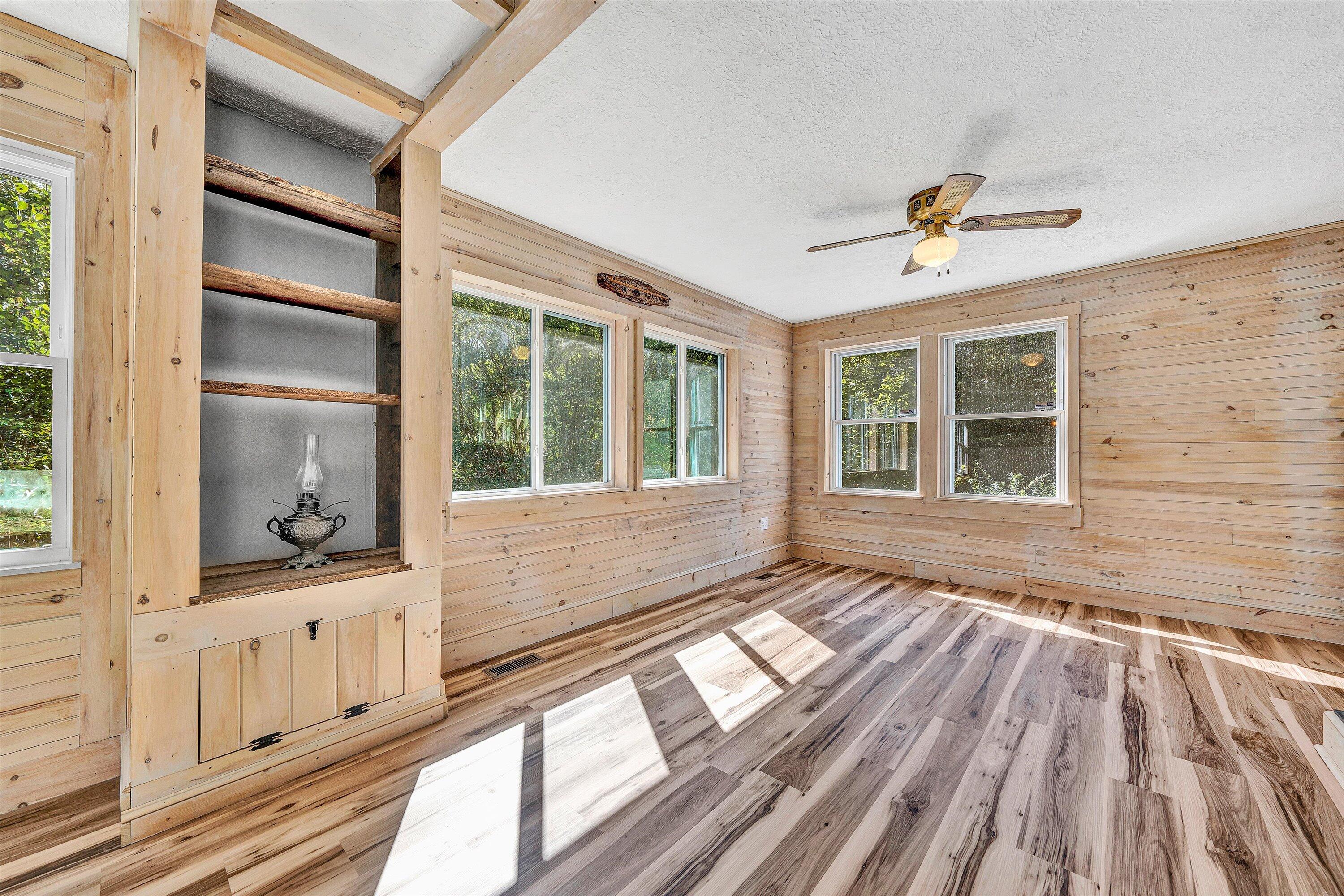 3561 Rutrough Road Southeast Roanoke, VA 24014 - Photo 34 of 63 a view of an empty room with a window and wooden floor