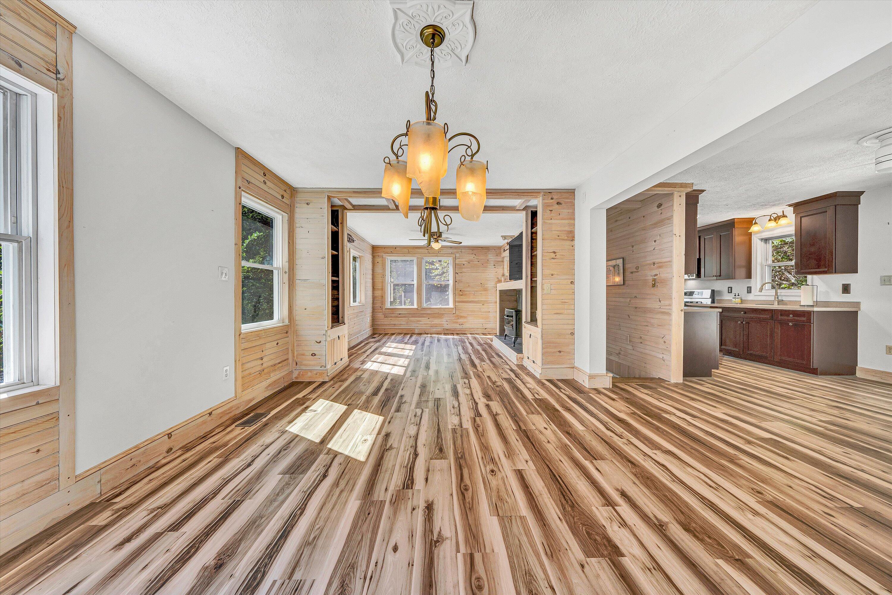 3561 Rutrough Road Southeast Roanoke, VA 24014 - Photo 36 of 63 a view of a living room with kitchen island wooden floor and windows