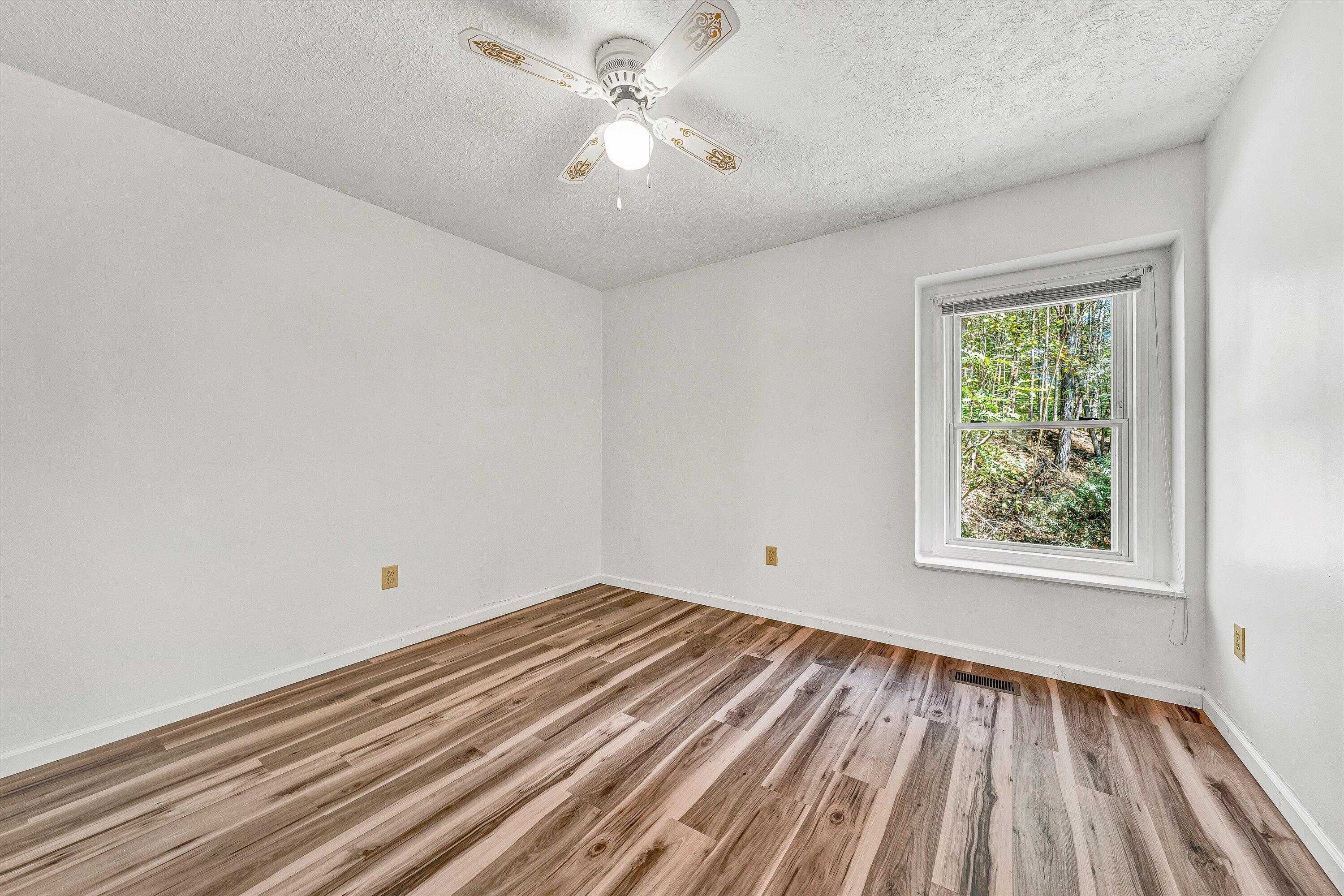 3561 Rutrough Road Southeast Roanoke, VA 24014 - Photo 39 of 63 wooden floor in an empty room with a window