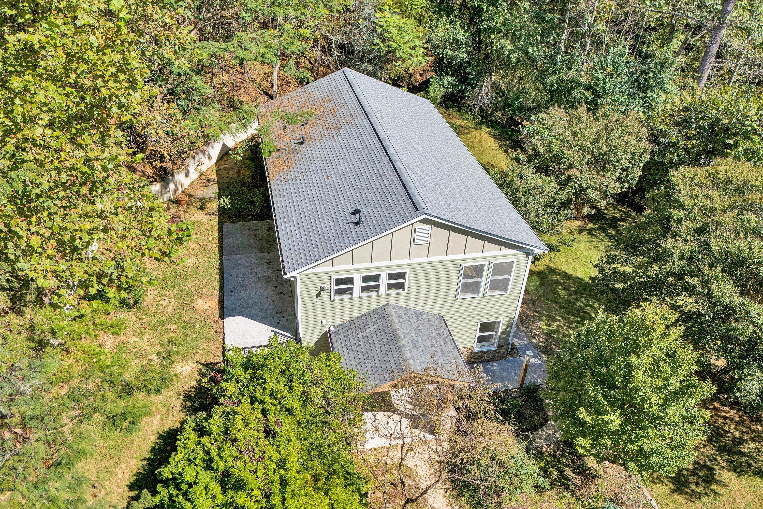 3561 Rutrough Road Southeast Roanoke, VA 24014 - Photo 4 of 63 a aerial view of a house with a yard and large trees