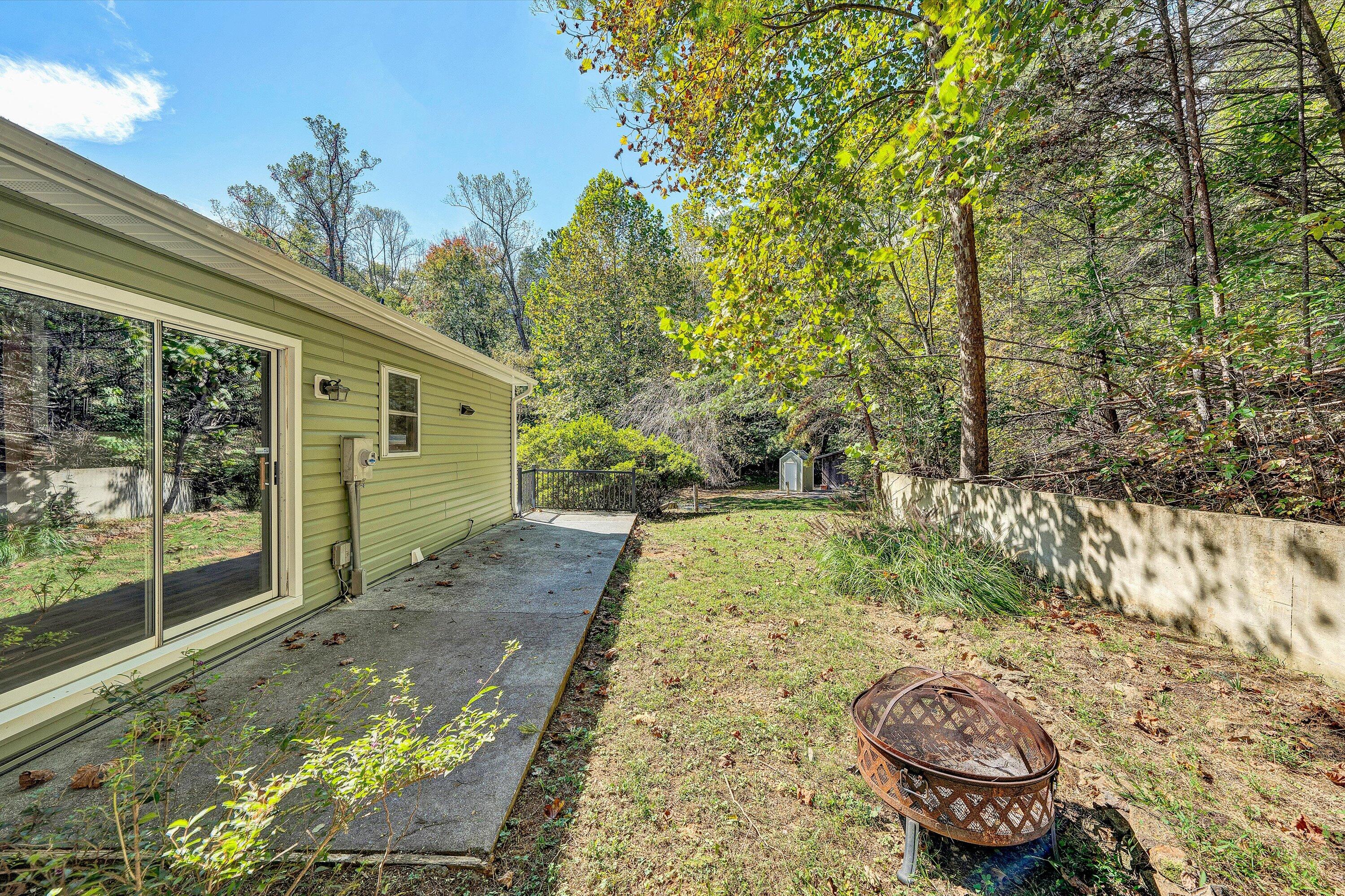 3561 Rutrough Road Southeast Roanoke, VA 24014 - Photo 46 of 63 a view of a backyard with potted plants