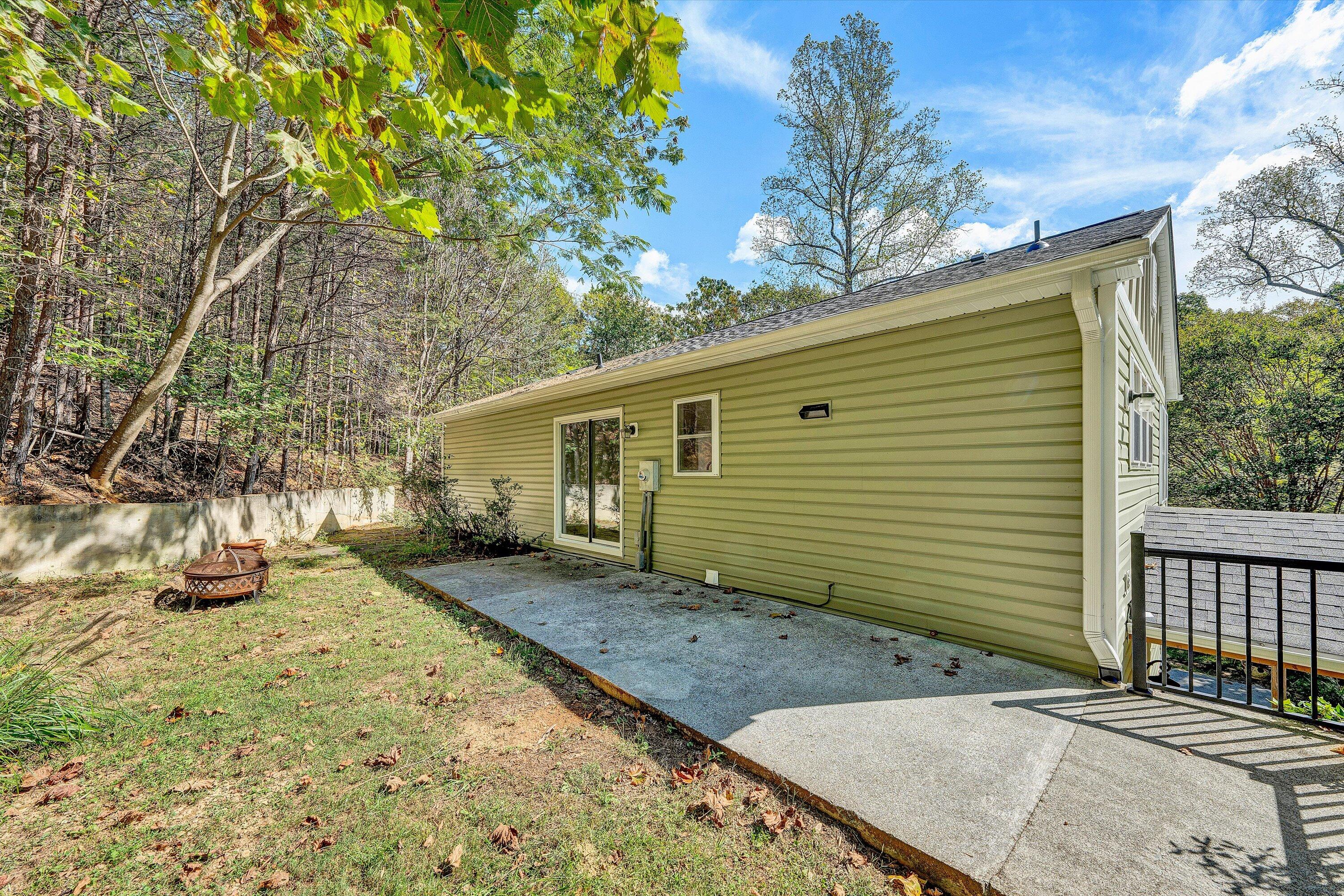 3561 Rutrough Road Southeast Roanoke, VA 24014 - Photo 48 of 63 a view of a backyard with a tree