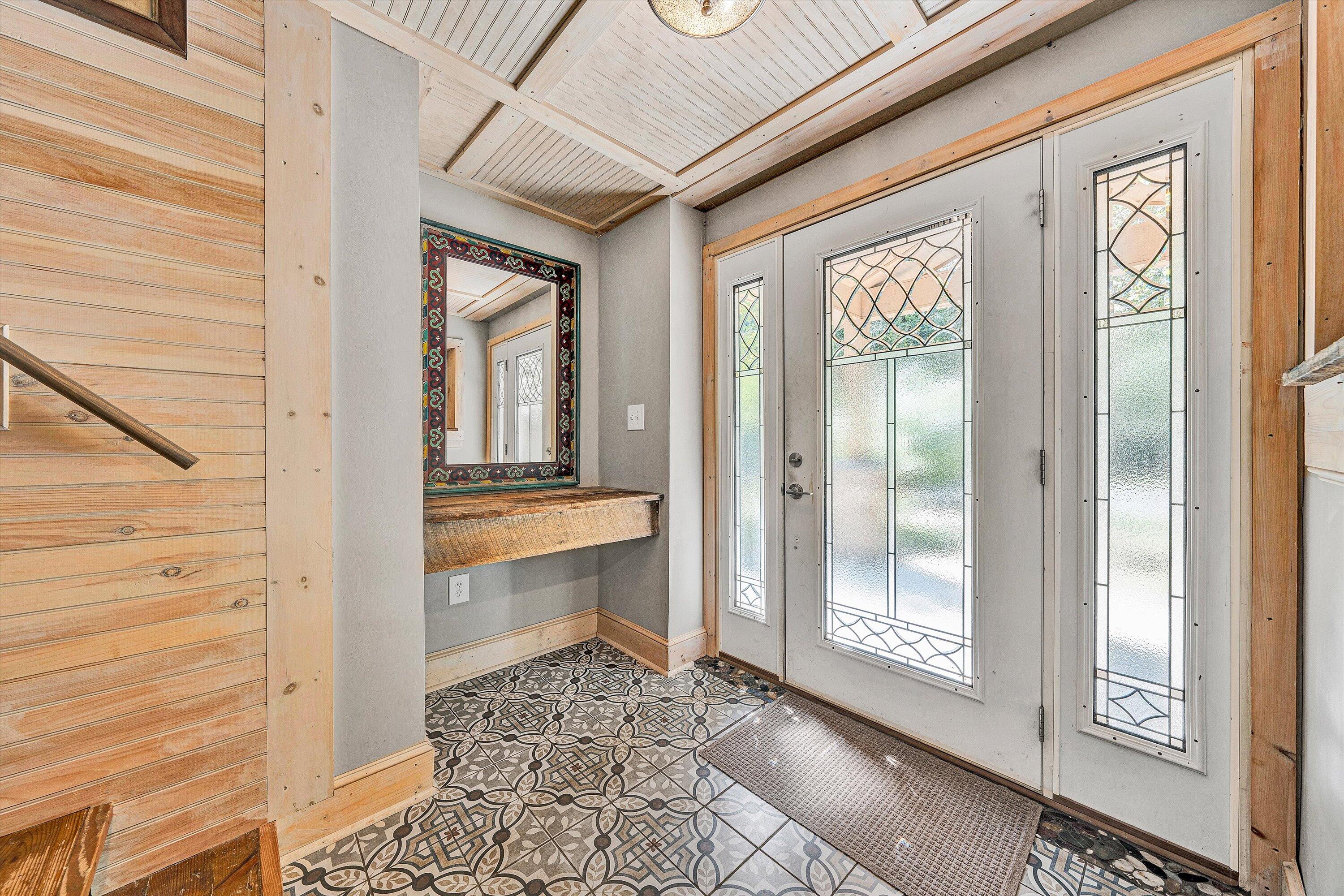 3561 Rutrough Road Southeast Roanoke, VA 24014 - Photo 9 of 63 a view of a hallway with windows and chandelier