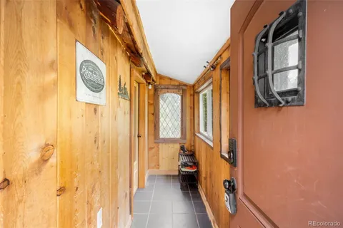 a view of an entryway with a mirror