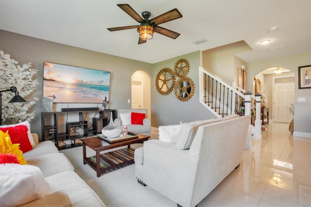 4583 Northeast 27th Street Ocala, FL 34470 - Photo 18 of 43 a living room with furniture and a fireplace