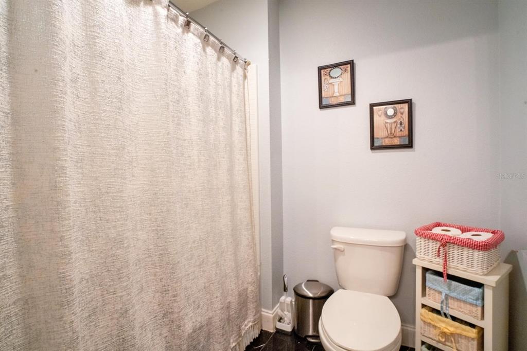 4583 Northeast 27th Street Ocala, FL 34470 - Photo 20 of 43 a white toilet sitting next to a small bathroom