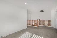 a view of a livingroom with stairs