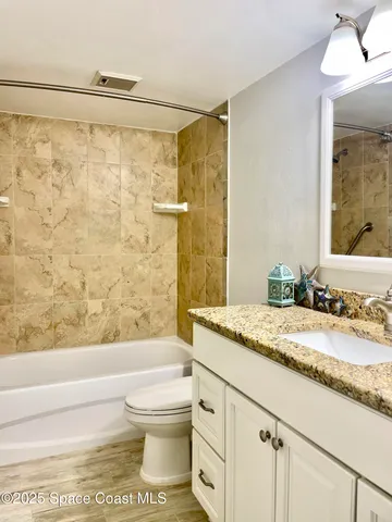 a view of a swimming pool with a lounge chairs