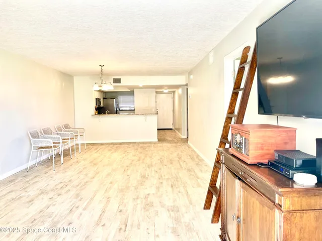 a view of livingroom with furniture and staircase