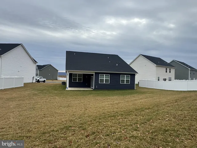 a view of a hallway with wooden floor and closet