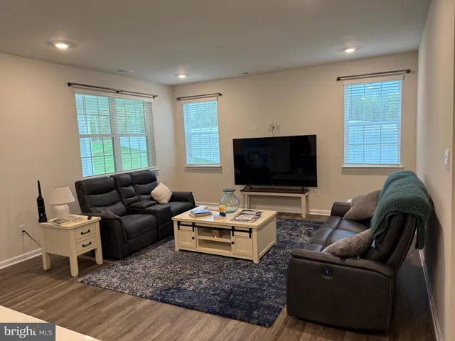 a workspace with furniture window and wooden floor