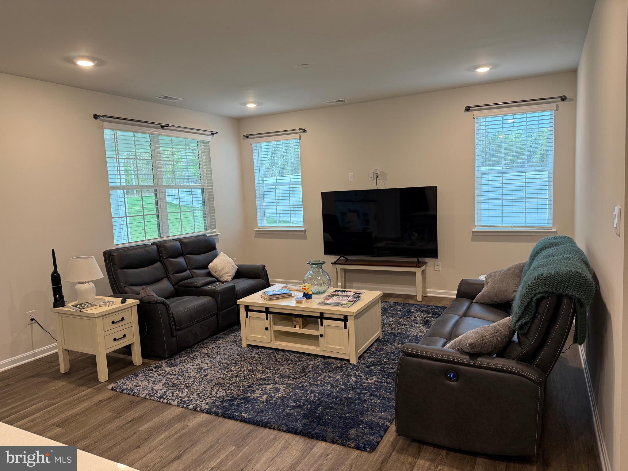 241 Atkinson Street Charles Town, WV 25414 - Photo 15 of 37 a living room with furniture and a flat screen tv