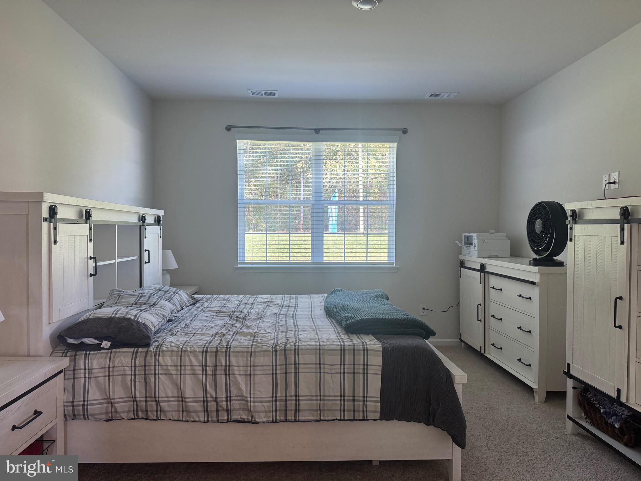 241 Atkinson Street Charles Town, WV 25414 - Photo 18 of 37 a bedroom with a bed and a window