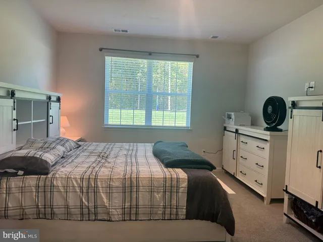 a bathroom with a double vanity sink and mirror