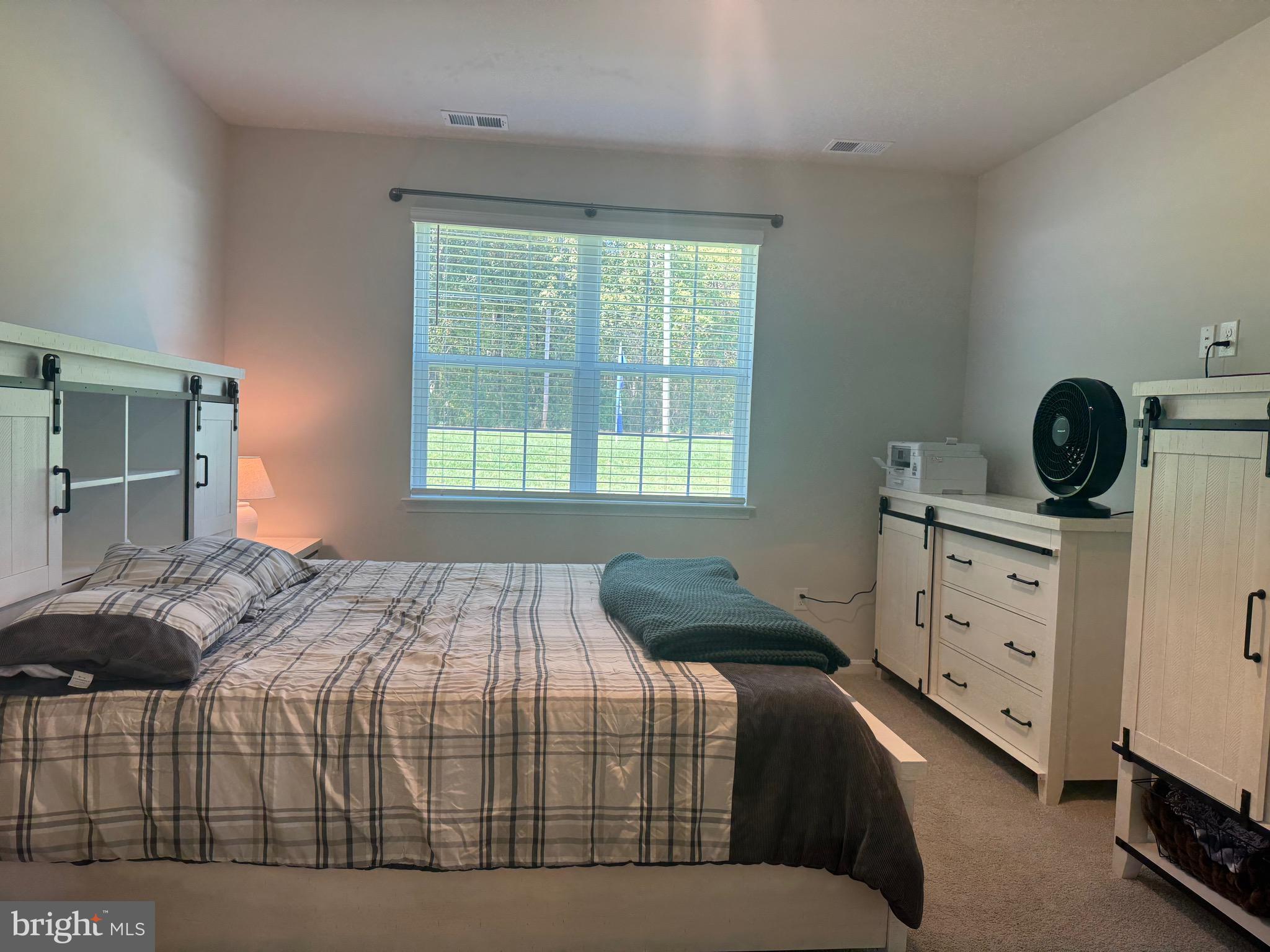 241 Atkinson Street Charles Town, WV 25414 - Photo 19 of 37 a bedroom with a bed and a window