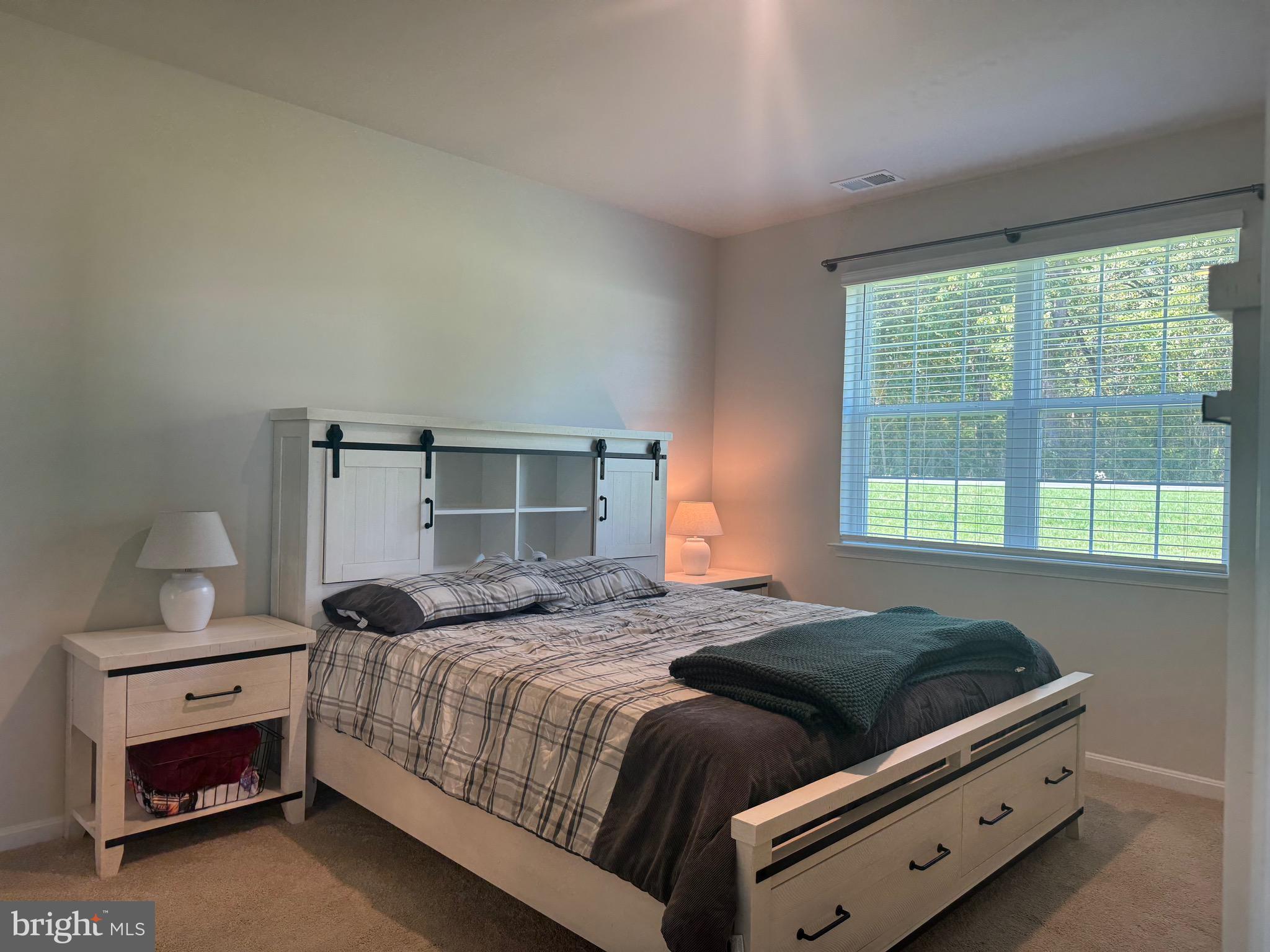 241 Atkinson Street Charles Town, WV 25414 - Photo 20 of 37 a bedroom with a bed and a window