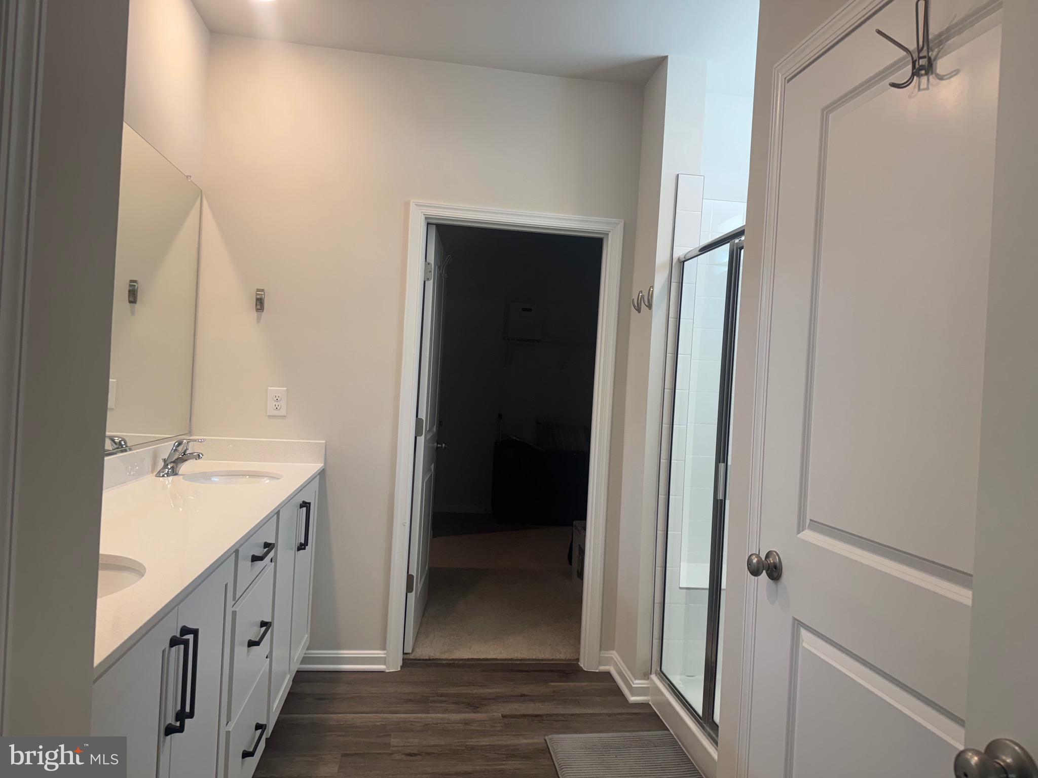 241 Atkinson Street Charles Town, WV 25414 - Photo 21 of 37 a bathroom with a double vanity sink and mirror