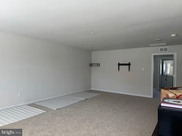 a bathroom with a sink a toilet and shower curtain