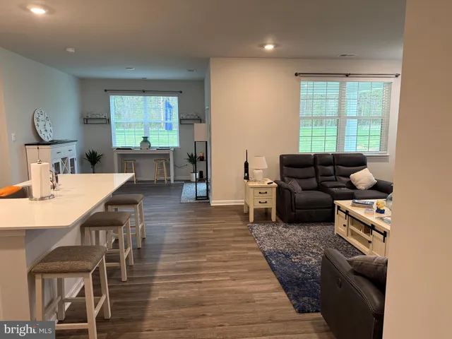 a kitchen with stainless steel appliances a stove refrigerator sink and microwave