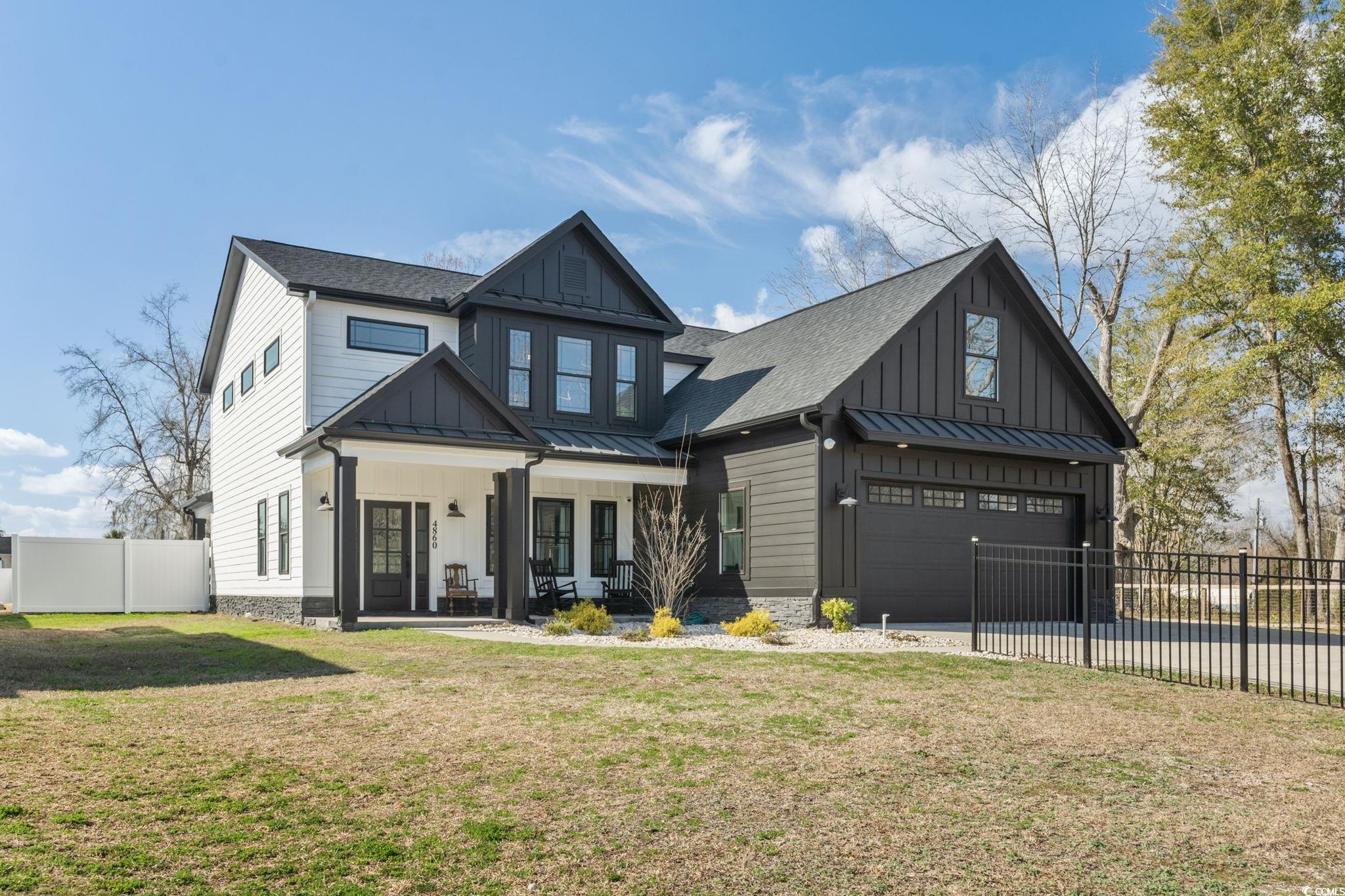 4860 Mill Pond Road Myrtle Beach, SC 29588 - Photo 1 of 40 View of front of property with a garage, a porch,