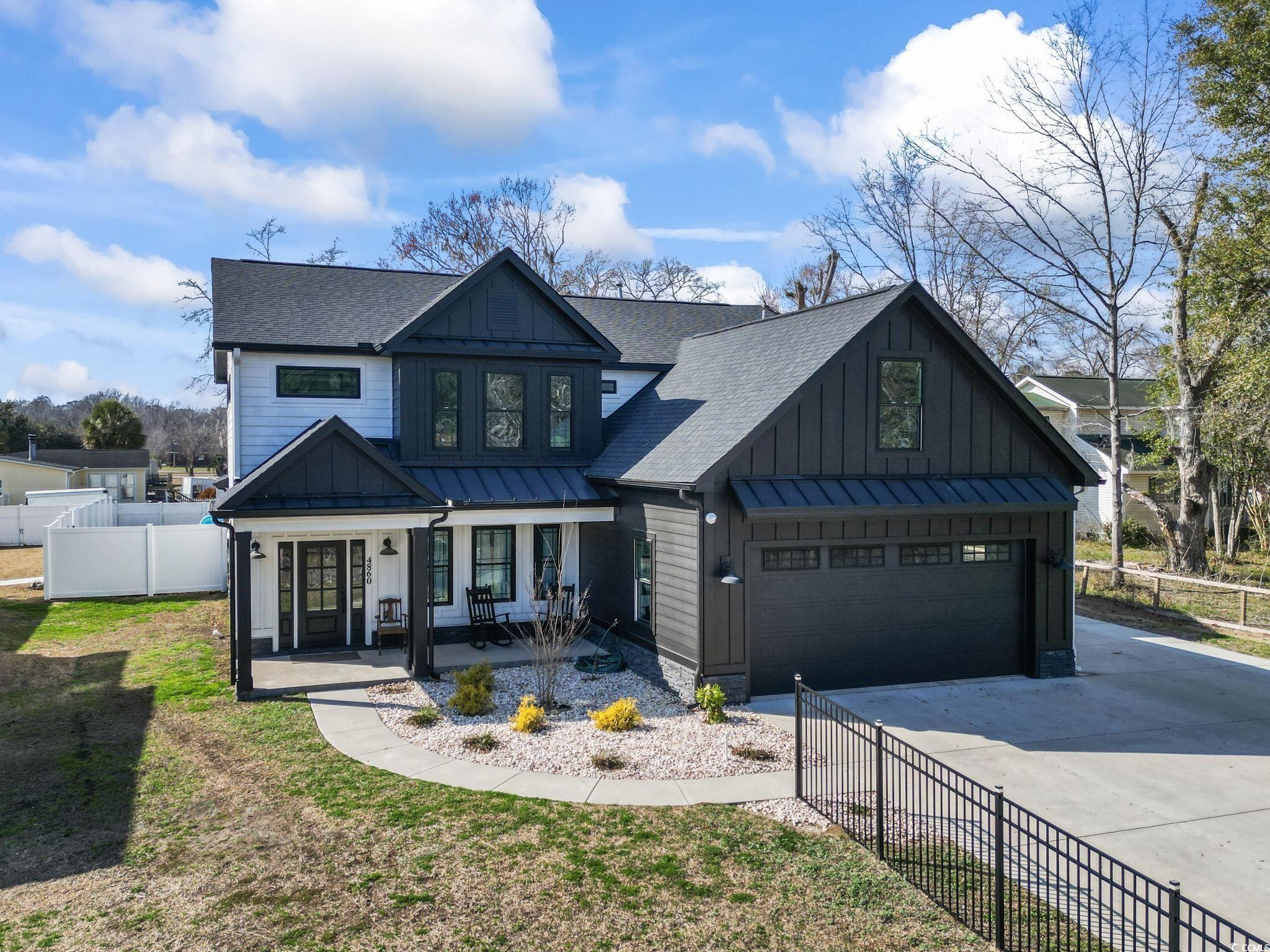 4860 Mill Pond Road Myrtle Beach, SC 29588 - Photo 3 of 40 View of front facade with a garage, covered porch,