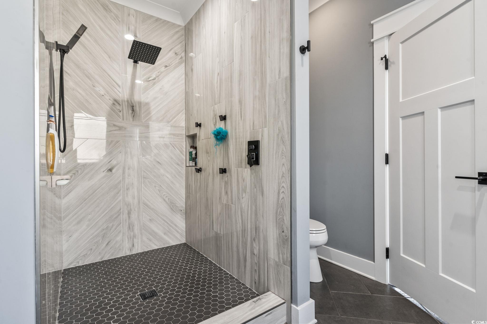 4860 Mill Pond Road Myrtle Beach, SC 29588 - Photo 34 of 40 Bathroom with tile patterned floors, toilet, and a