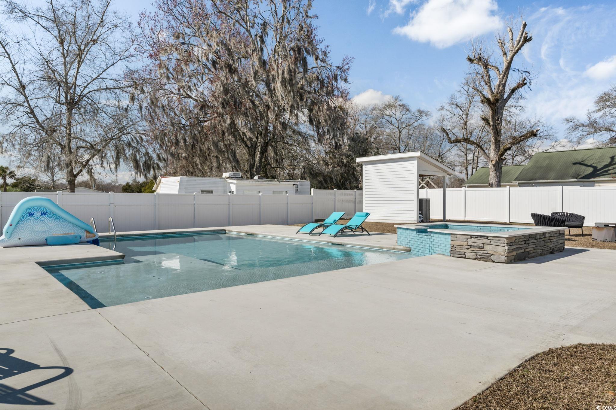 4860 Mill Pond Road Myrtle Beach, SC 29588 - Photo 37 of 40 View of pool featuring a patio and an in ground ho