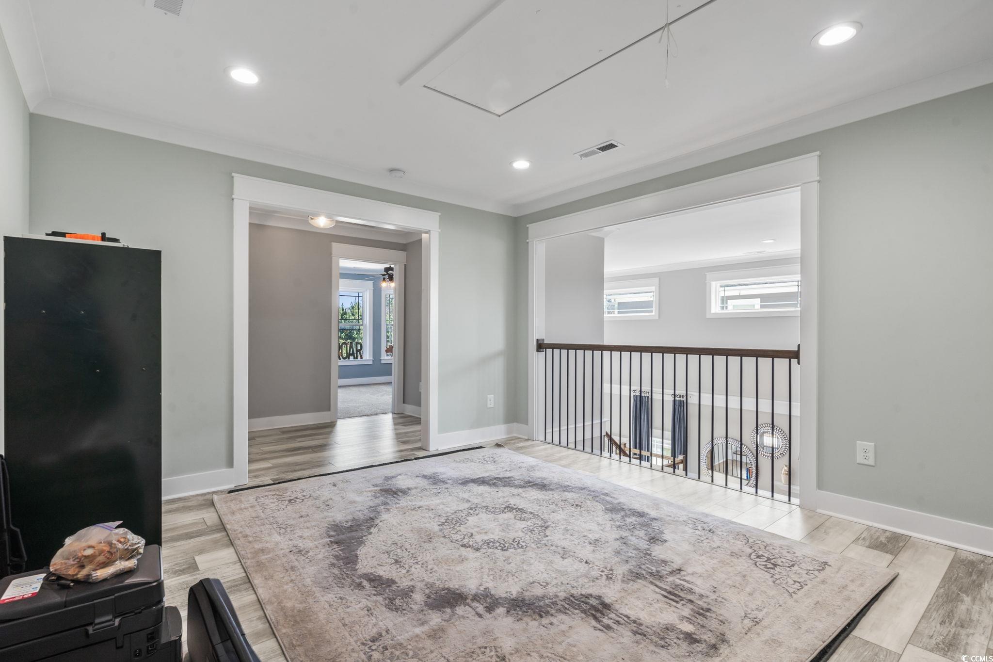 4860 Mill Pond Road Myrtle Beach, SC 29588 - Photo 9 of 40 Unfurnished room with crown molding, a healthy amo