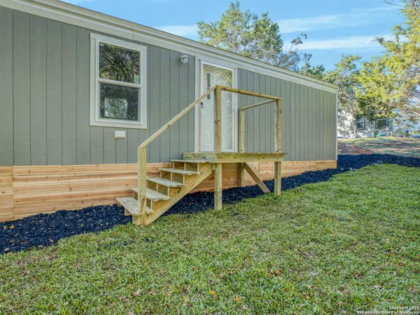 a house view with a backyard