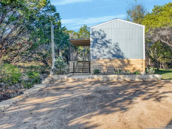 a view of a back yard of the house
