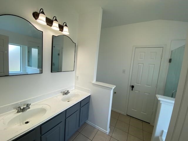 a bathroom with a double vanity sink and mirror