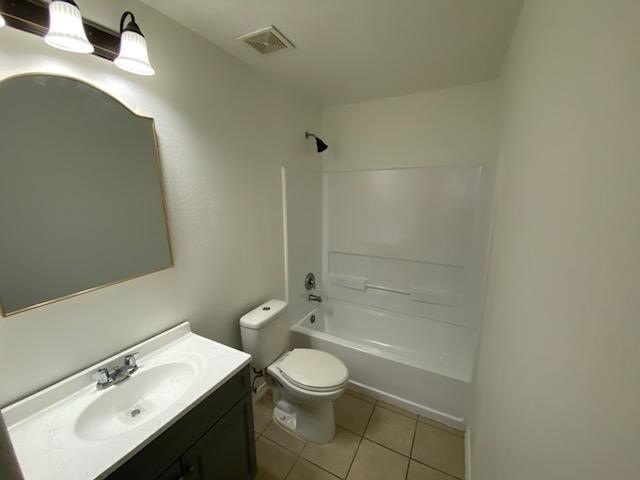 9530 Alex Springs Lane Houston, TX 77044 - Photo 7 of 8 a bathroom with a granite countertop sink toilet a mirror and shower