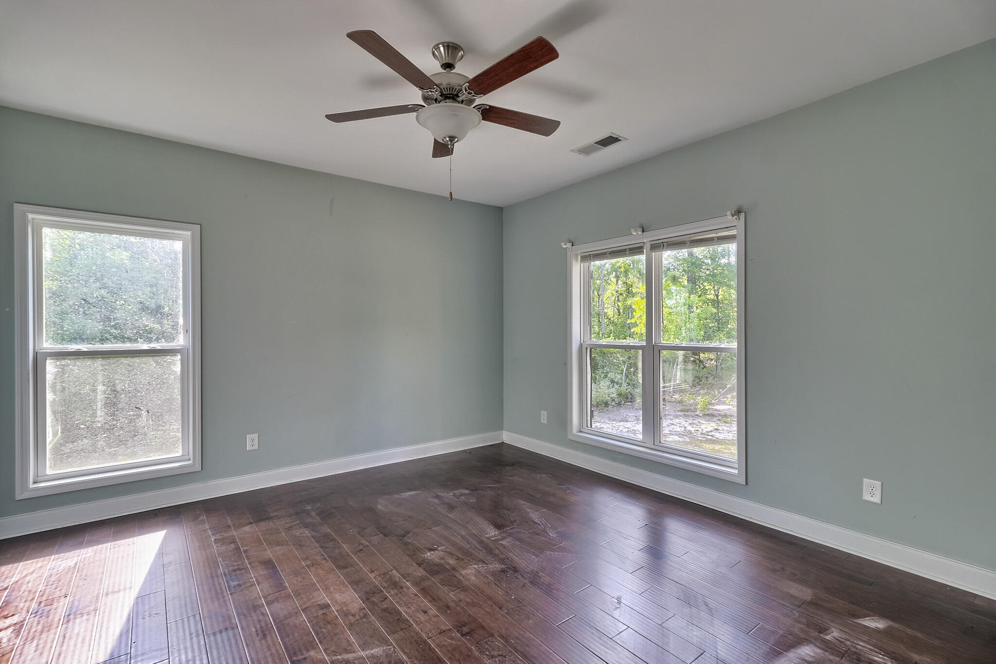 912 Goldie Road Leesville, SC 29070 - Photo 15 of 23 a view of a big room with wooden floor and windows