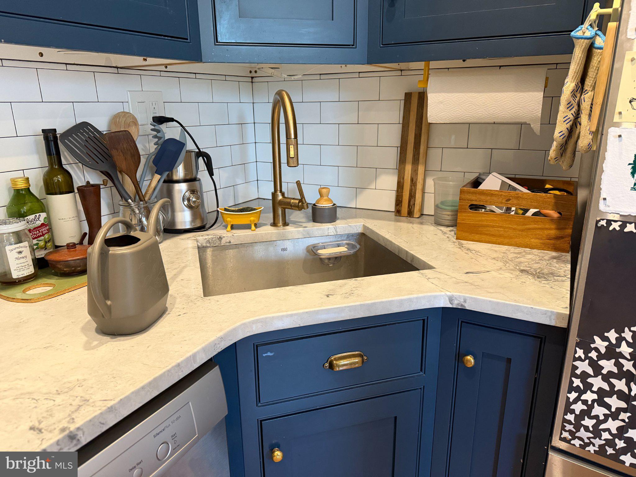 815 South 49th Street Philadelphia, PA 19143 - Photo 28 of 72 Charming blue kitchen with modern flair.
