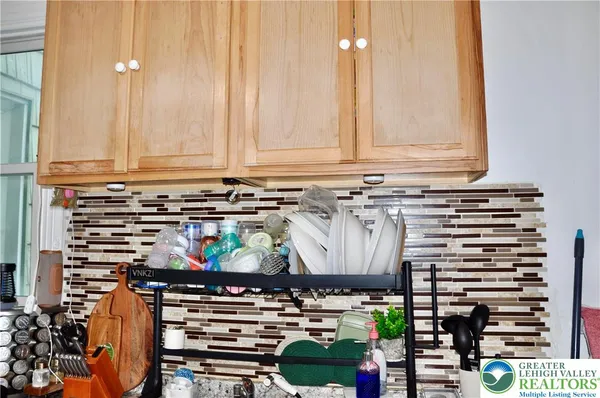 a view of room with stainless steel appliances kitchen island table and chairs